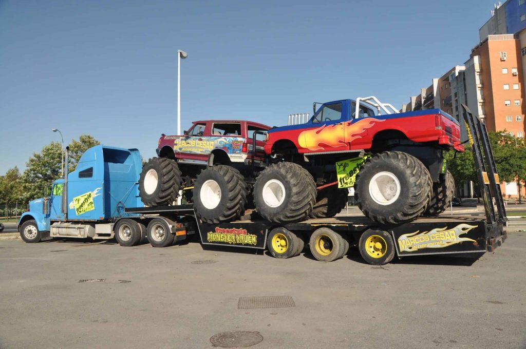 Trailer with two monster truck for Hot shot courier services